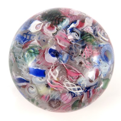 Lot 864 - A scrambled millefiori glass paperweight,...