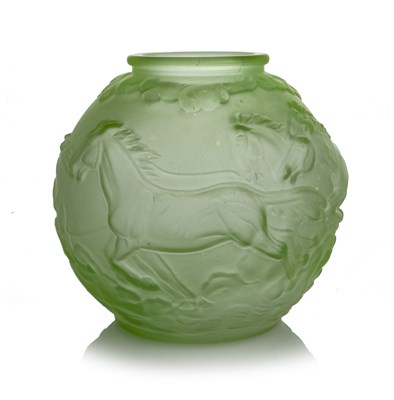Lot 893 - A Czech Art Deco moulded green glass vase,...