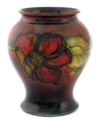 Lot 914 - Walter Moorcroft, a Flambe Clematis vase,...