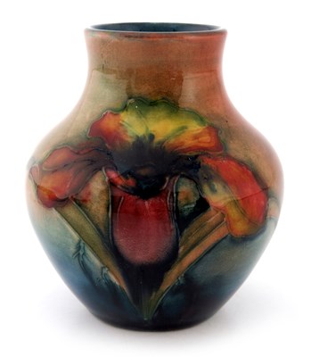 Lot 916 - Walter Moorcroft, a small Flambe Orchid vase,...
