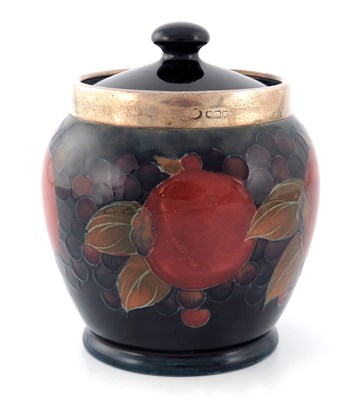 Lot 933 - William Moorcroft, a Pomegranate silver...