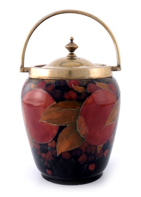 Lot 937 - William Moorcroft, a Pomegranate on ochre and...