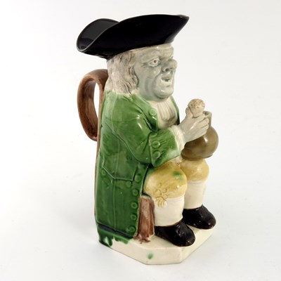 Lot 1116 - A Ralph Wood family creamware Toby Jug of...