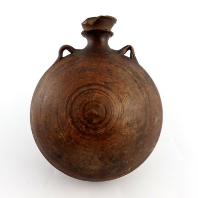 Lot 1118 - A 15th century ceramic costrell, circular with...