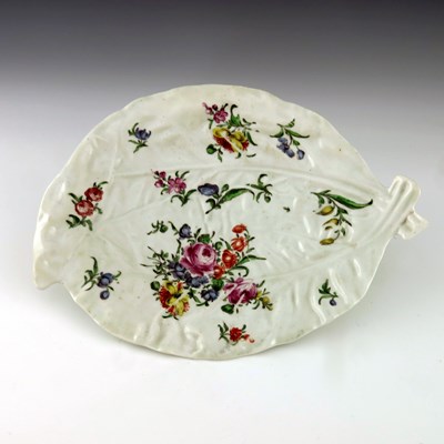 Lot 1140 - A Worcester polychrome cos lettuce leaf...