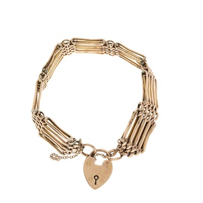 Lot 92 - An early 20th century 9ct gold gate bracelet, with heart-shape padlock clasp