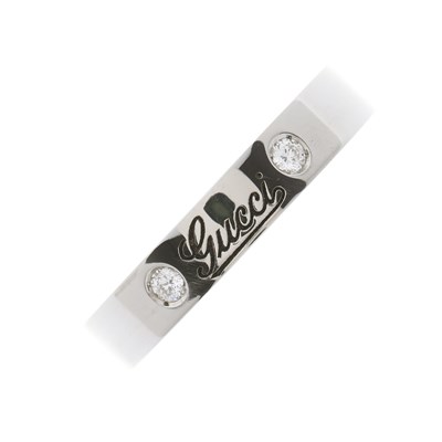 Lot 138 - Gucci, an 18ct gold brilliant-cut diamond...