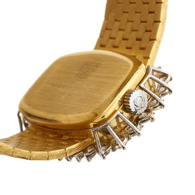 Lot 231 - Omega, an 18ct gold diamond bracelet watch,...