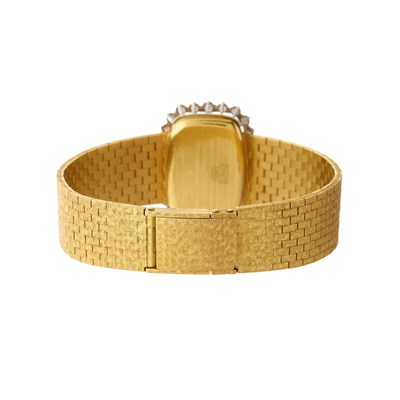 Lot 231 - Omega, an 18ct gold diamond bracelet watch,...
