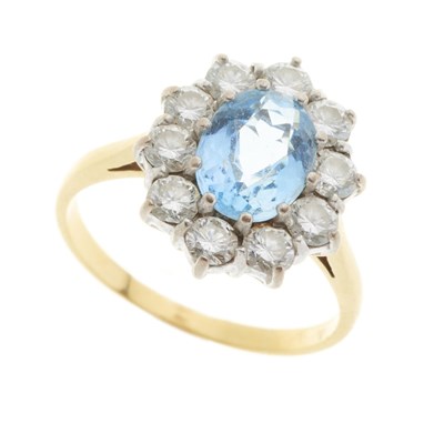 Lot 75 - An 18ct gold aquamarine and diamond cluster dress ring
