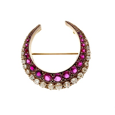Lot 49 - A late Victorian silver and gold, ruby and diamond crescent brooch