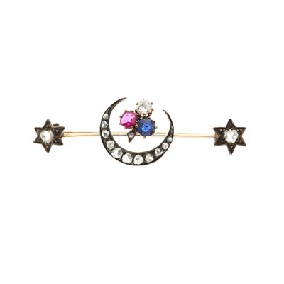 Lot 104 - A late Victorian ruby, sapphire and diamond shamrock crescent brooch