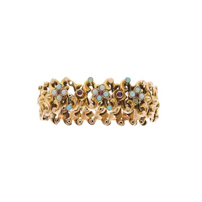 Lot 12 - A late Victorian 9ct gold opal and ruby expanding bangle bracelet