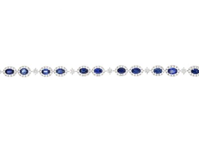 Lot 62 - An 18ct gold sapphire and diamond line bracelet