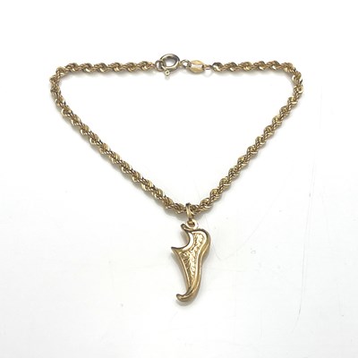 Lot 23 - A 9ct gold rope-twist bracelet, with charm