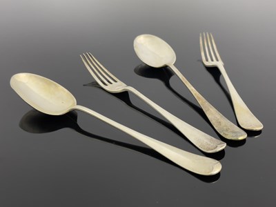 Lot 57 - Two pairs of George V silver table spoons and...