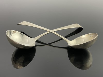 Lot 34 - A pair of George III silver suace ladles,...