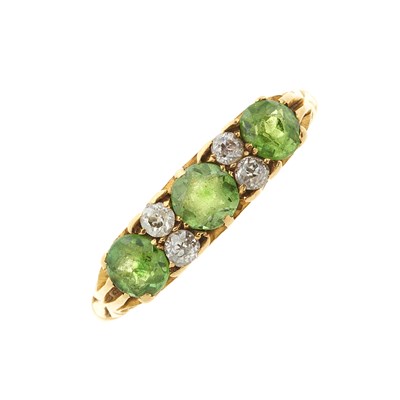 Lot 101 - An Edwardian 18ct gold demantoid garnet and diamond dress ring