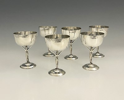 Lot 26 - A set of six Edwardian silver wine cups, each...