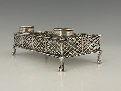 Lot 44 - A George II silver two-bottle inkstand or desk...