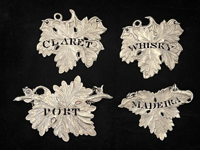 Lot 12 - Four similar Victorian silver wine labels or...