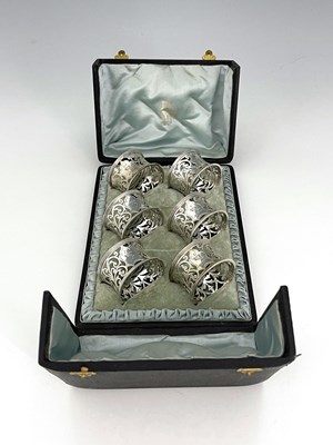 Lot 212 - A cased set of six Edwardian silver napkin...