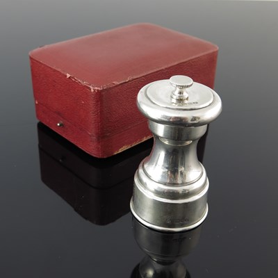 Lot 220 - An Edwardian silver-mounted pepper grinder, of...