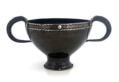 Lot 148 - An Arts and Crafts copper and silver twin...