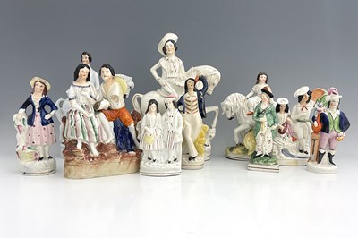 Lot 1068 - A collection of Staffordshire figures,...