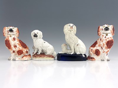 Lot 1028 - A collection of Staffordshire dogs, circa 1860,...