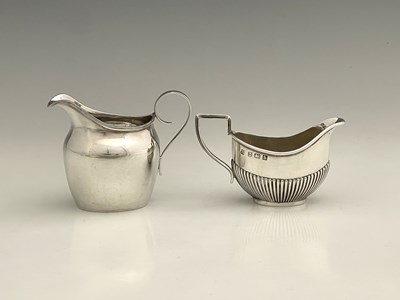 Lot 208 - Two hallmarked silver cream or milk jugs, each...