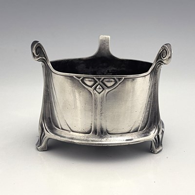 Lot 132 - Albin Muller for WMF, a pewter bottle coaster,...