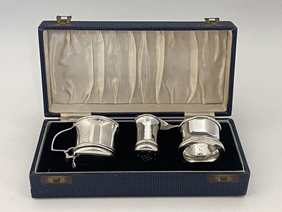 Lot 42 - A George V silver three-piece condiment set,...