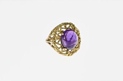 Lot 60 - A Modernist 9 carat gold and amethyst cabochon...