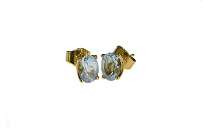 Lot 6 - A pair of 18 carat gold and blue topaz...