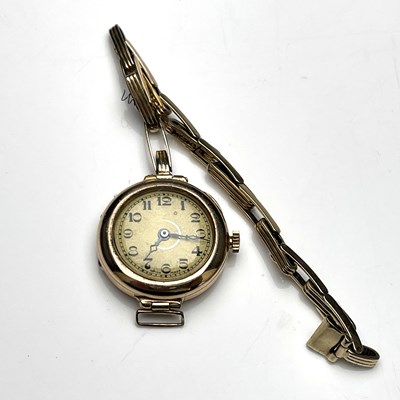 Lot 63 - A 9 carat gold ladies wristwatch on spring...