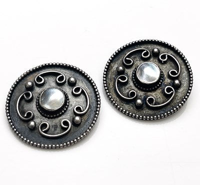 Lot 36 - A pair of Arts and Crafts silver and mother of...