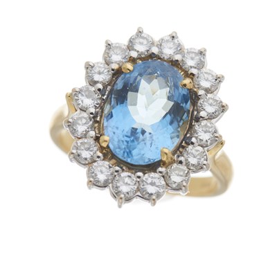 Lot 32 - An 18ct gold aquamarine and diamond cluster ring