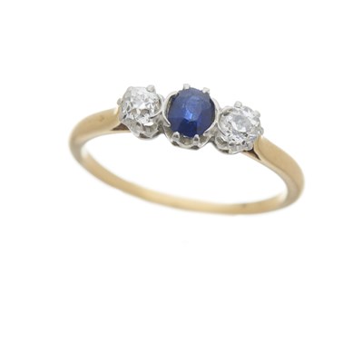 Lot 59 - An early 20th century 18ct gold sapphire and diamond three-stone ring