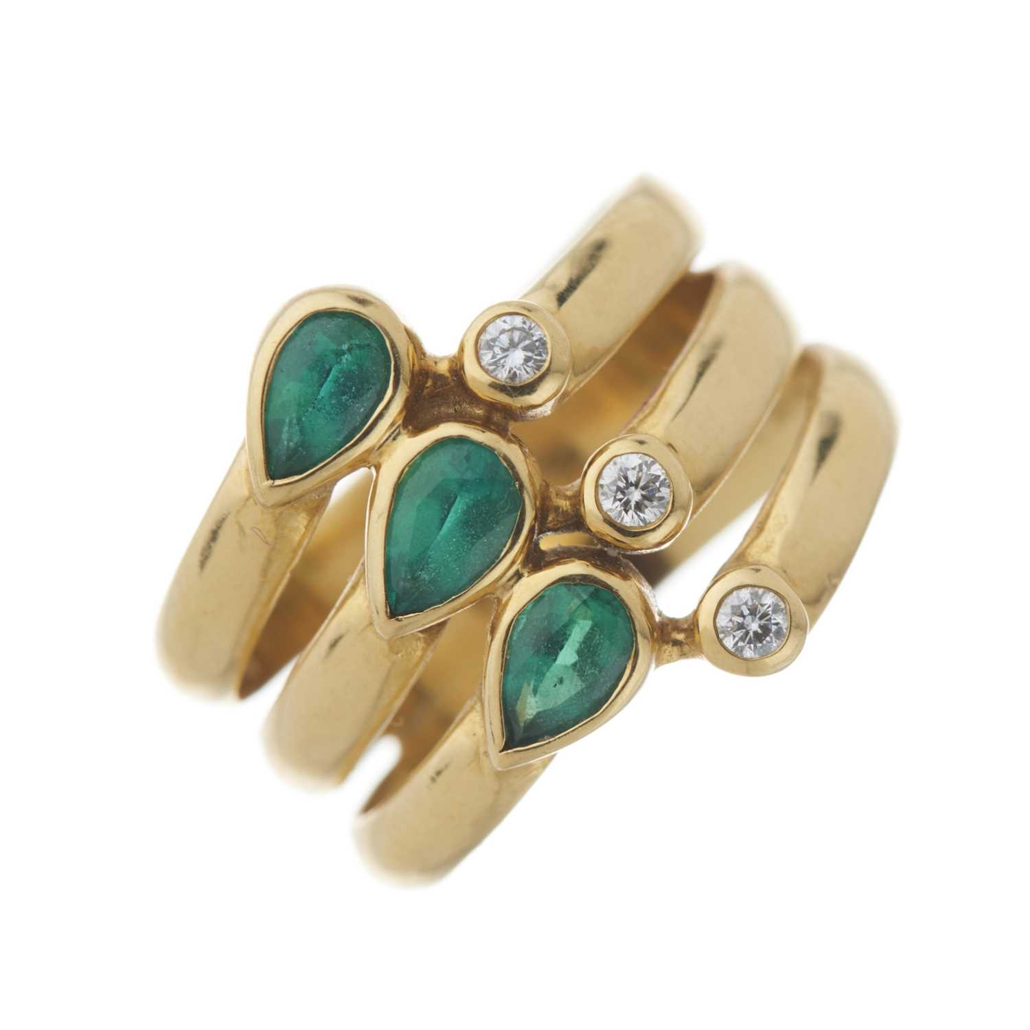 Lot 31 - An 18ct gold emerald and diamond dress ring