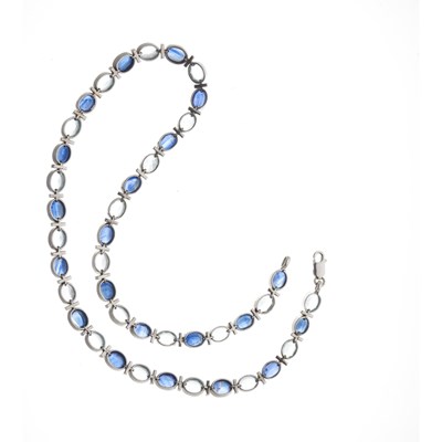 Lot 88 - An 18ct gold sapphire and aquamarine line necklace