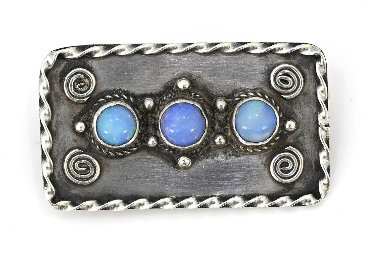 Lot 34 - An Arts and Crafts silver and opal cabochon...