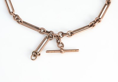 Lot 21 - A 9ct rose gold trombone link double Albert...