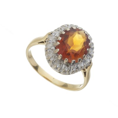 Lot 74 - An 18ct gold citrine and diamond cluster ring