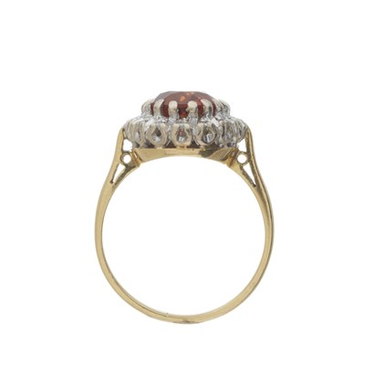 Lot 74 - An 18ct gold citrine and diamond cluster ring
