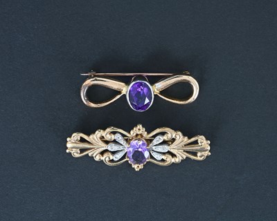 Lot 6 - Two gold amethyst brooches