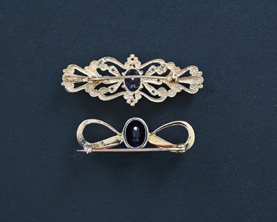 Lot 6 - Two gold amethyst brooches
