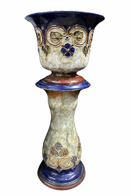 Lot 553 - A Royal Doulton stoneware jardiniere on stand,...