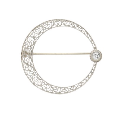 Lot 5 - A Belle Epoque diamond accent openwork crescent brooch