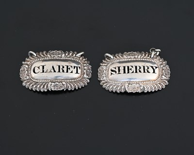 Lot 118 - A pair of George IV Regency silver wine labels...